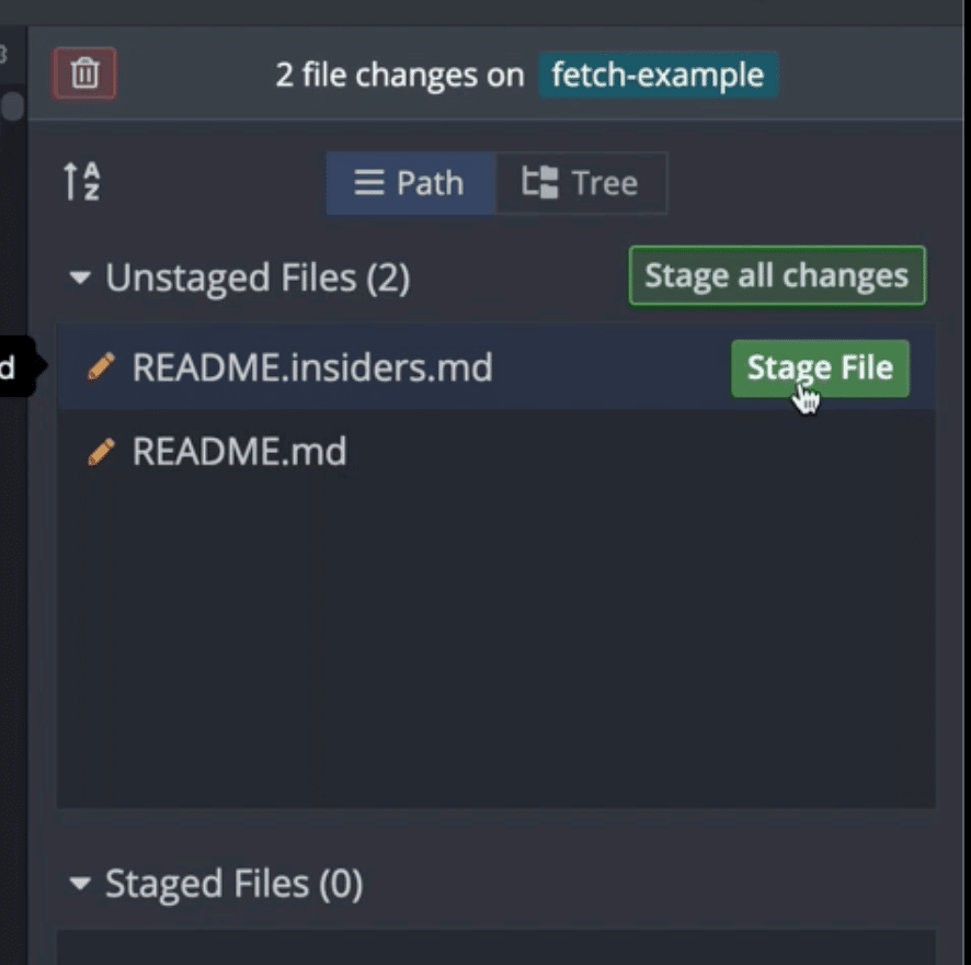 Clicking the stage file button for a single file called README.insiders.md in GitKraken Desktop.