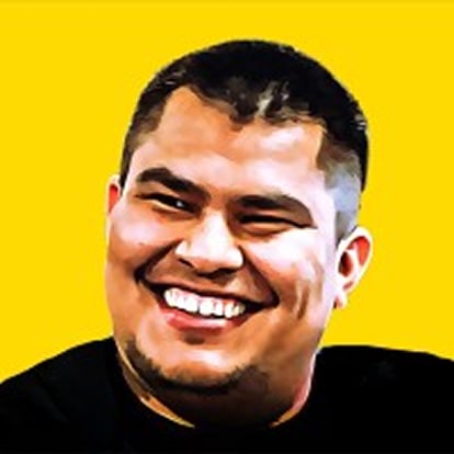 Smiling man with short hair wearing a black tee.